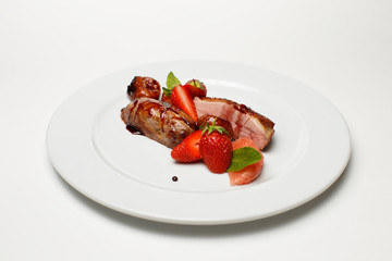 meat in sweet and sour sauce in strawberries and figs