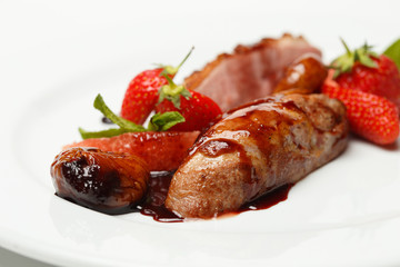 meat in sweet and sour sauce in strawberries and figs