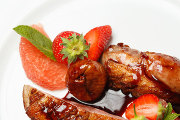 meat in sweet and sour sauce in strawberries and figs