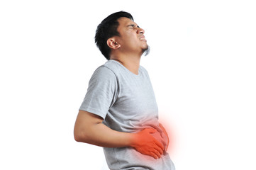 Asian young man getting stomach ache or getting abdominal pain health problem discomfort diarrhea