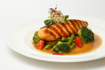 grilled salmon steak with steamed vegetable