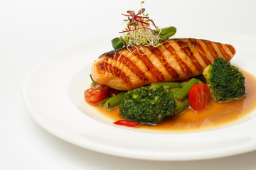 grilled salmon steak with steamed vegetable