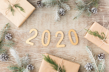 Christmas composition with garland made of 2020 text on wooden background. Christmas, winter, New Year concept. Flat lay, top view