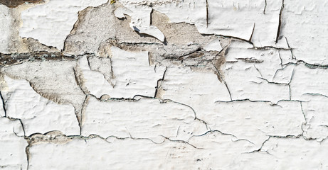 Cracked white paint texture background. Old wood texture with white peeling paint. Different fractures of paint. Background for text or design