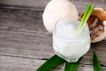 Obraz na płótnie Canvas Fresh coconut juice in a glass with coconut white meat isolated on white