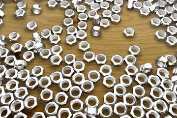 female screws on wooden table - beautiful industrial 3D illustration, image for any using