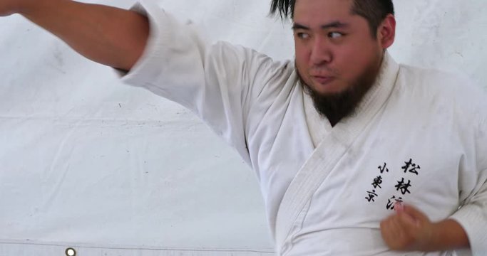Young Japanese American man at Judo martial arts training and competition in Little Tokyo in Los Angeles downtown, California, 4K