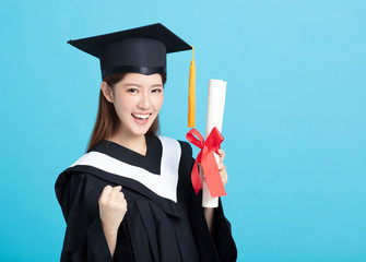 Happy asian female graduate student holding  diploma isolated