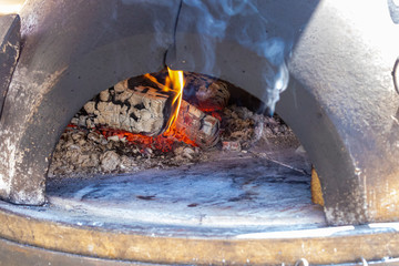 Flamme im Holzofen