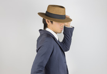 Young Asian Portrait Businessman Touch Hat Brim at Side View