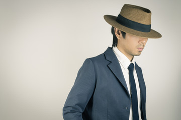 Young Asian Portrait Businessman Wear Hat in Zoom View in Vintage Tone
