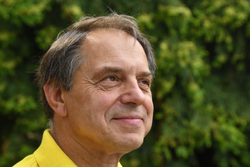 Portrait of man smiling outdoor.