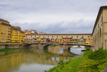 View of the old Golden Bridge on a cloudy September day. Florence, Italy