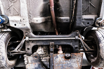 Fototapeta premium Under view Car body repair, car exhaust pipe tube structure.