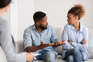 African American Husband Talking To Wife On Marital Therapy Session