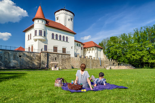 People in park in front of Budatin castle in Zilina, Slovakia