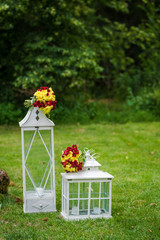 Red and yellow wedding flower decoration. Rustic style decoraion