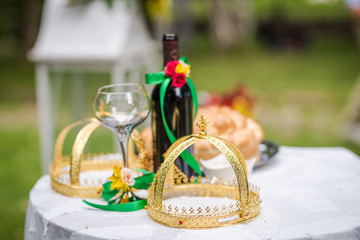 Objects for a orthodox wedding ceremony - a glass of wine , bread, christian cross and the Bible