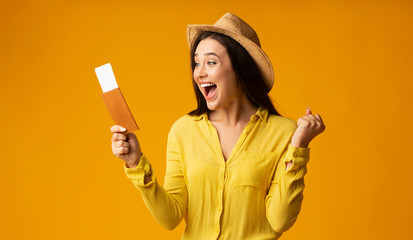 Happy Woman Traveler Holding Tickets And Passport, Studio Shot