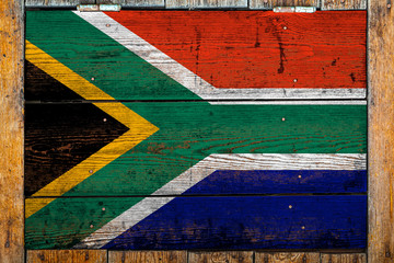 National flag of South African Republic on a wooden wall background.The concept of national pride...