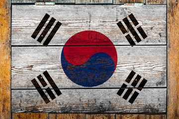National flag of South Korea on a wooden wall background.The concept of national pride and symbol...