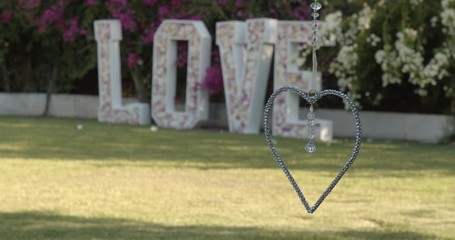 Decorative wedding spinning Heart and flower love sign in background, with copy space.