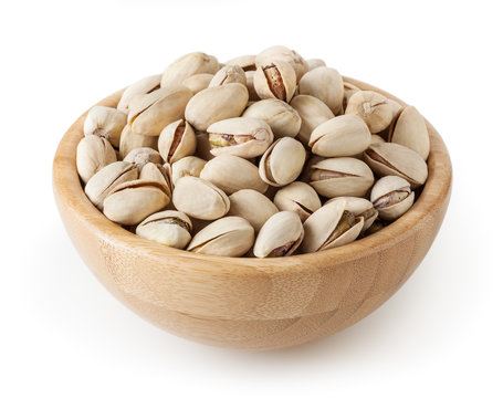 Premium Photo  Pistachio nuts in wooden bowl isolated on white background  top view