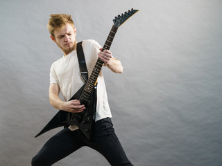 Fototapeta premium Man playing on electric guitar
