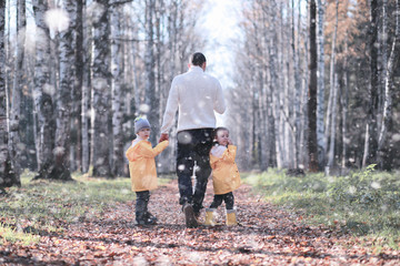 Kids walk in the park first snow