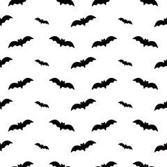 Vector seamless pattern background with bats silhouettes for international bat night or halloween design.