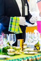 Waiter ready to service at Thanksgiving party dinner in restaurant.