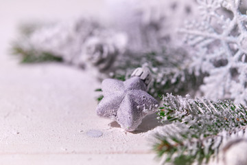 Christmas card - Christmas tree branches on the wooden background