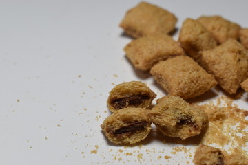 Pieces of chocolate on a white board