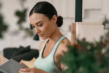 Joyful female involved in reading stock photo