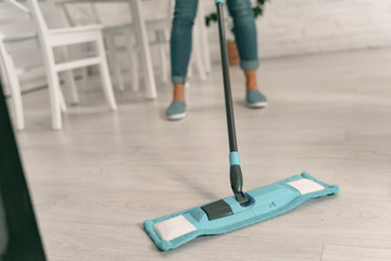 Housewife doing cleaning with mop stock photo