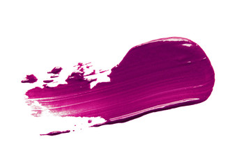 Lipstick smear smudge swatch isolated on white background. Cream makeup texture. Purple color...