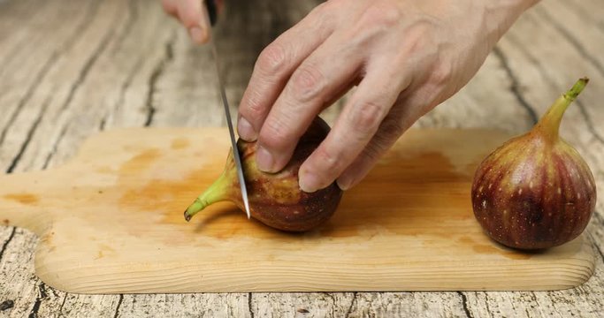 Cutting fresh figs to make compote