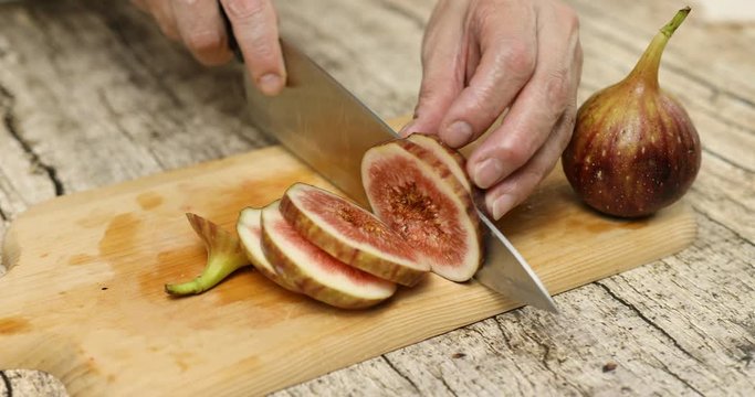 Cutting fresh figs to make compote