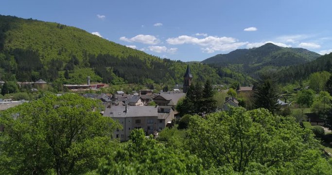 Florac appearing behind trees, Loz&egrave;re, France