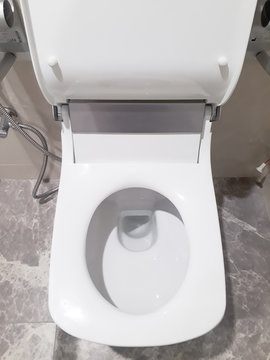 Toilet, Flushing Water, close up, flush toilet , White toilet in the bathroom, Top view of toilet bowl