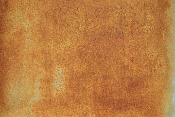 bright red-orange iron sheet. Rust compound is an iron oxide. Deep rust, oxide and corrosion texture on a metal surface.