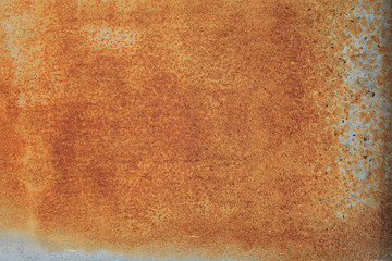 bright red-orange iron sheet. Rust compound is an iron oxide. Deep rust, oxide and corrosion texture on a metal surface.