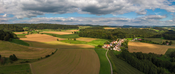Fototapeta na wymiar Panoramic view on an agricultural landscape near Stockach in Germany.