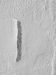 peeling of dry color on white wall texture