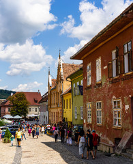 Sighisoara, Romania - 2019. People wandering on the streets of Sighisoara citadel (old town)....