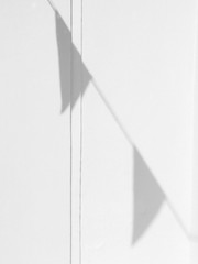 shadow of flag on white wall background