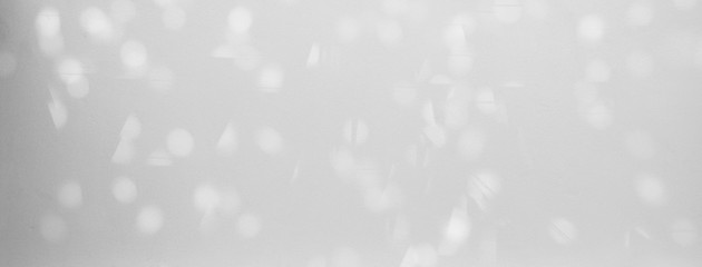 blur bokeh of sunlight on white wall background