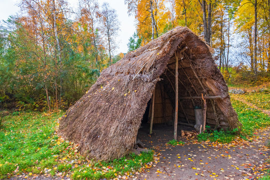 Grass hut in an autumn landscape