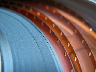Roll of developed Super 16mm Film Negative on a Bobby in a can. 16mm Film is a popular and...