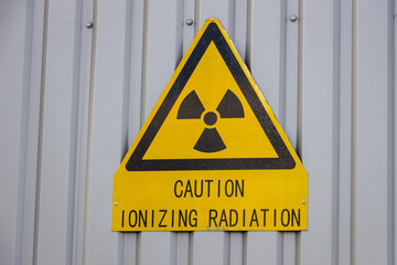 Caution ionizing radiation sign on the wall
